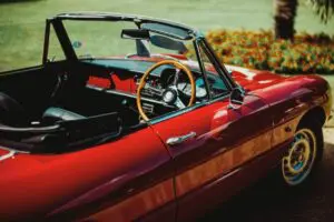 red and black convertible coupe
